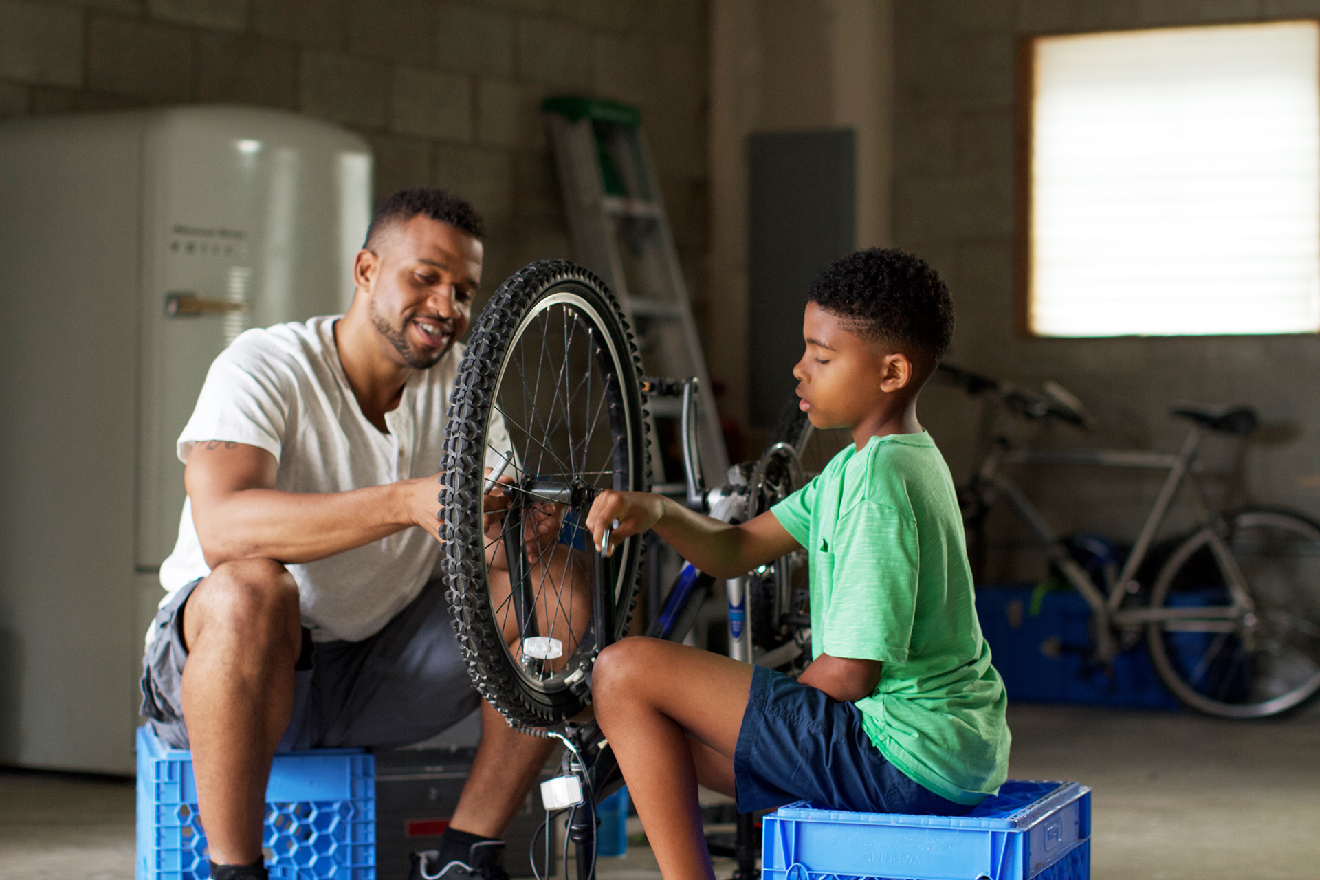 Father and daughter fixing bike