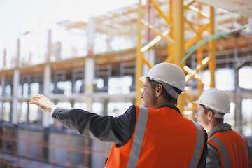 Workers in orange vests