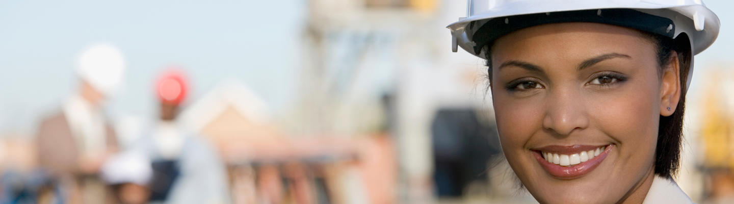 Woman wearing a hard hat and smiling