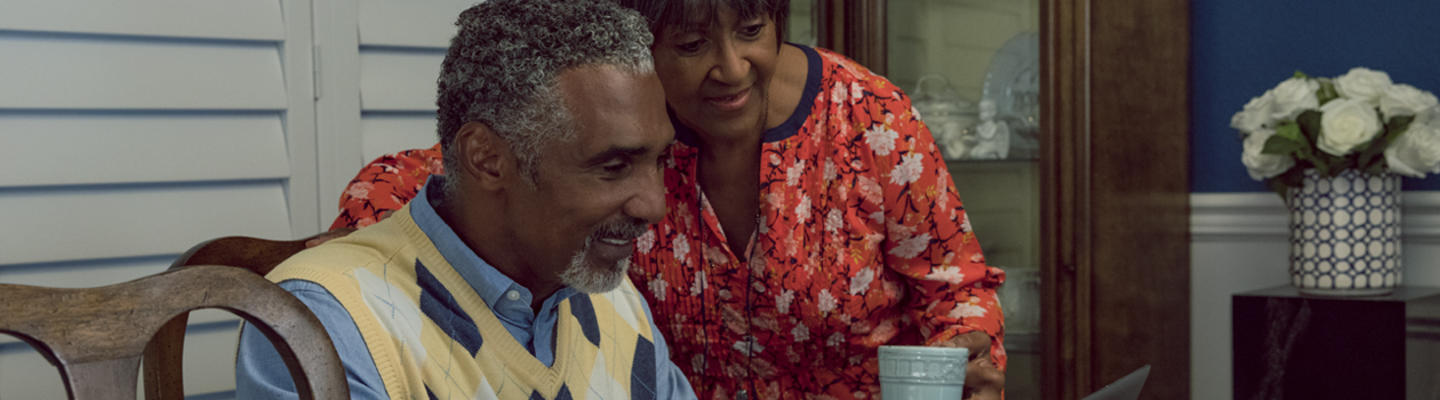 senior couple looking at computer