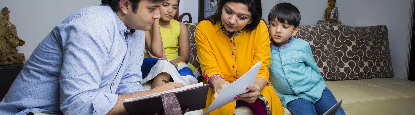 Family looking at papers